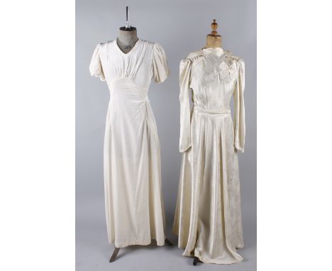 A collection of eight vintage wedding dresses, comprising: a 1940s white lace wedding gown, a cream satin wedding dress with 