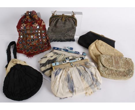 An early 20th century black silk evening bag with celluloid frame and Cameo detailed clasp, a 1920s silk evening bag with an 