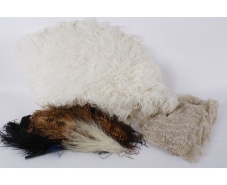 A late 19th century large white ostrich feather fan, with mother of pearl guards and sticks; together with a quantity of misc