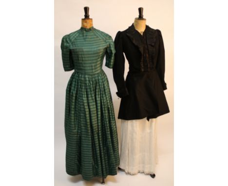 A late 19th century white spotted three-piece lawn costume, a jade green 19th century striped silk dress, a black Victorian b