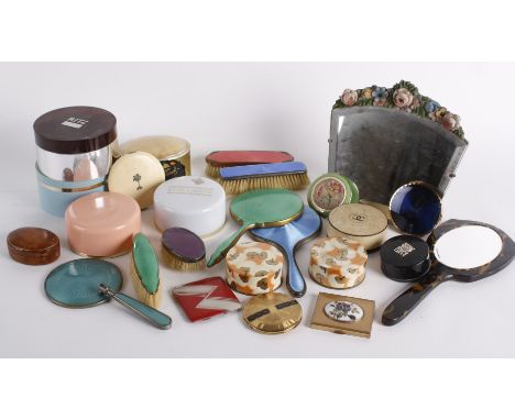 A collection of cosmetics, powder compacts, accessories and dressing table items, including: a small 1930s Barbola mirror, He