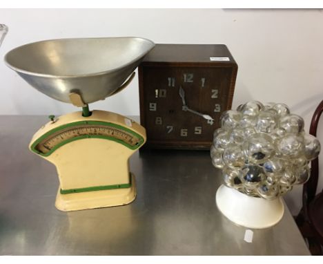 An early 20th Century oak cased clock, salter scales and glass wall light.