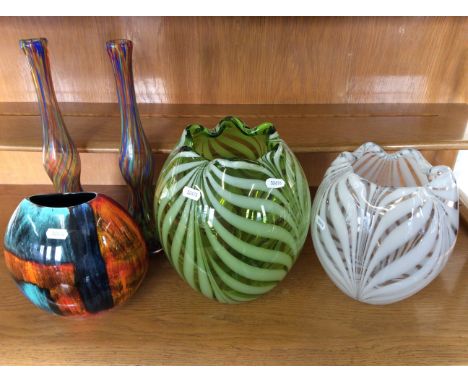 A Poole pottery vase, two candy striped vases and two multicoloured glass vases.