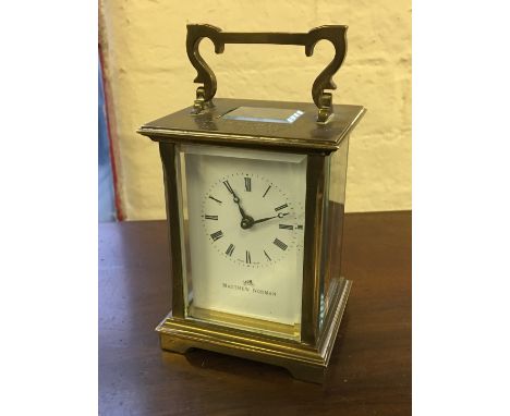 A Matthew Norman brass carriage clock, engraved to top 'F. C. Precast Concrete Ltd, DLW Seabrook 1961 to 1986'