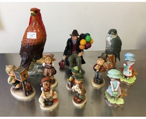 A lot to include Royal Doutlon balloon seller, two bird whiskey bottles, six Goebbel Hummel figures etc.