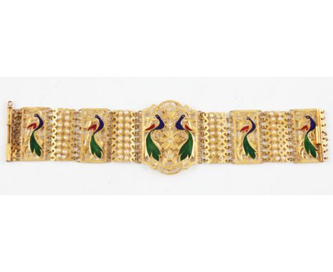 A gilt metal and enamel bracelet accented with white sapphires and seed pearls, featuring enamelled open metalwork peacock de