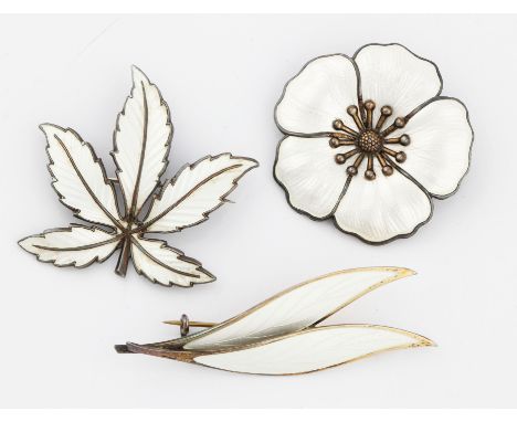 A collection of three Norwegian white enamel brooches, one designed as a leaf, stamped 925S STERLING, with makers mark MB, an
