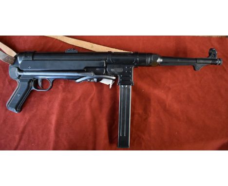 German WWII Replica MP40 with sling, made by Marushin Plug Fire Cartridge Firing weapons and takes 7mm caps with the plug fir