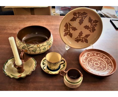 British Pottery including a Longpark Torquay Jug, Candlestick holder and Coffee cup with saucer with one floral decorated bow