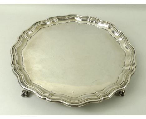 A silver salver, Chippendale piecrust edge, raised on four ball and claw feet, Sheffield 1924, James Dixon Sons, 26.44toz, 29