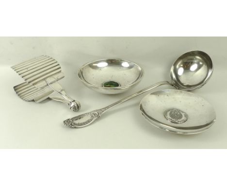 A sterling silver bon bon dish, with a German 5 Mark 1888 coin to the centre, 13cm diameter, a German white metal ladle, a me