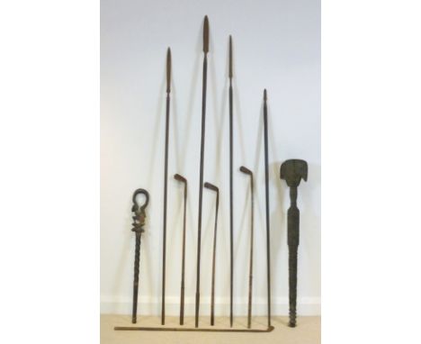 A 19th century wooden mace with ribbed handle and four 'bladed' head, possibly African, an African short hardwood staff carve