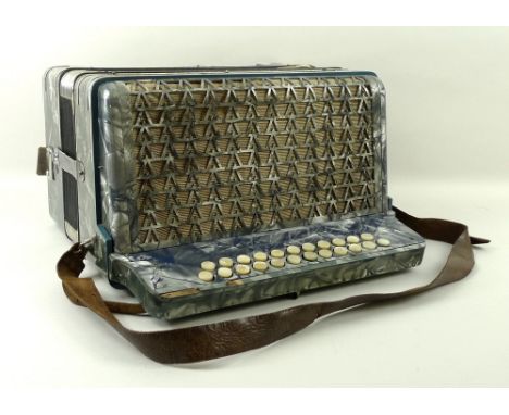 A 1920's Organola piano accordion deluxe, with a blue and grey marbled body, cased.
