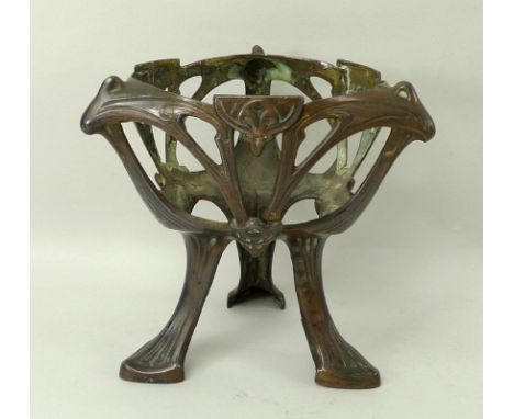 A French Art Nouveau stand, circa 1930, the pierced copper alloy tripod stand decorated with cast crests and naturalistic scr