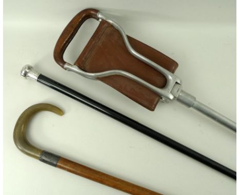 A silver and malacca cane, London 1907, Thomas Dicks, 90cm, a horn and silver walking stick, 84cm, and a shooting stick. (3)