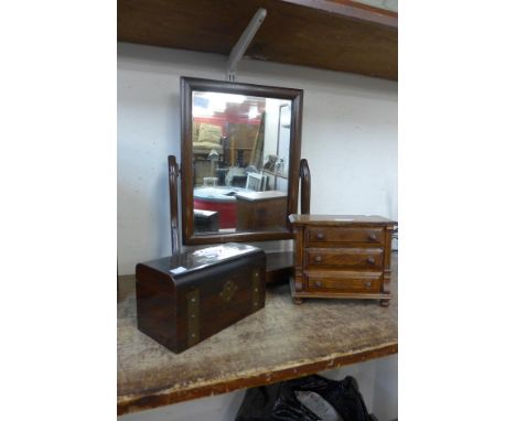 An early 20th Century mahogany toilet mirror, miniature oak chest of drawers and a rosewood and brass tea caddy