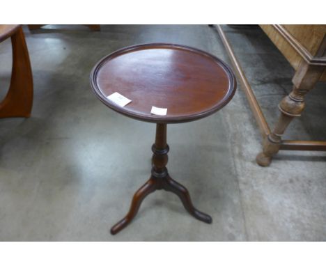 An Edward VII mahogany tripod wine table 