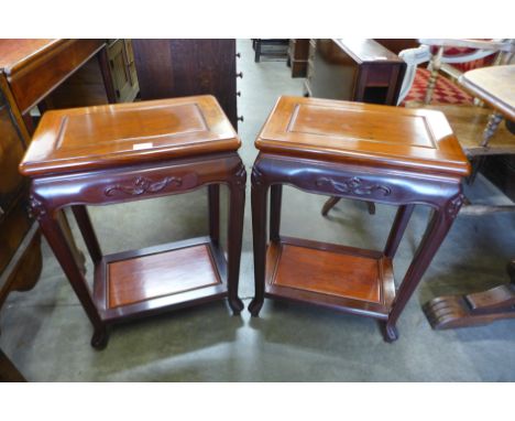 A pair of Chinese hardwood lamp tables 