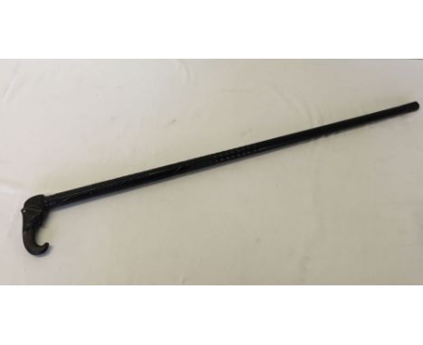 Carved ebony walking stick with elephant handle.