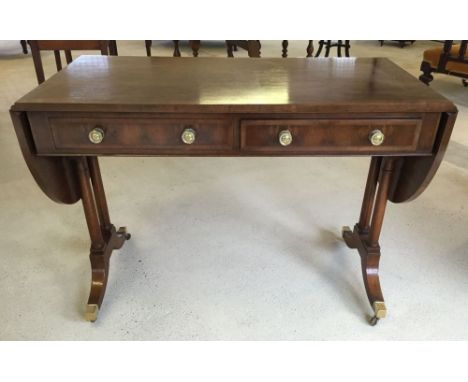 A Victorian walnut sofa table. 51 x 180cm when end leaves open.