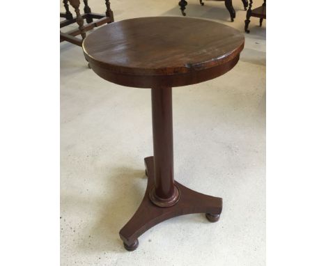 A Victorian mahogany tripod wine table.