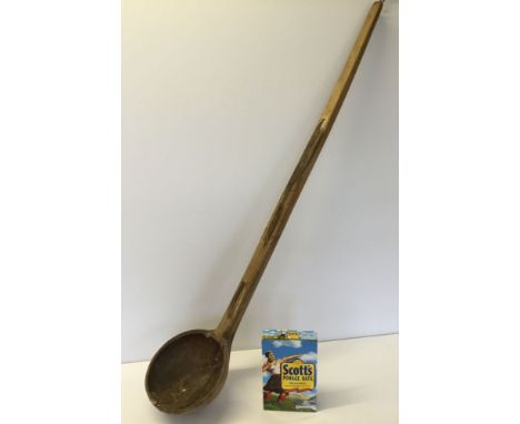 A giant rustic wooden porridge ladle/stirrer - 4 feet 2 inches long. Antiques Road Trip lot