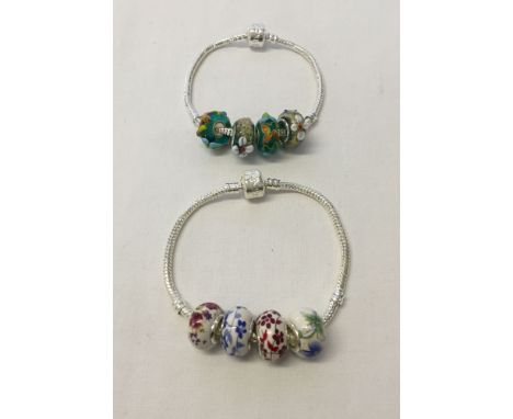 2 925 silver bracelets, one with Murano glass charms with applied flowers & the other with floral ceramic charms.