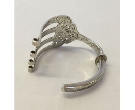 A HM Victorian silver bangle made from a fish serving fork. Sheffield 1851, approx 69.3g, maker A. Hadfield.