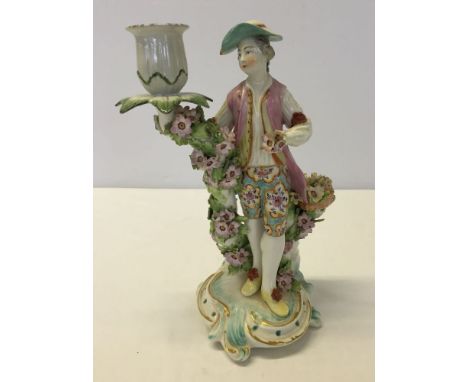 18th century Derby candlestick figure 'Shepherd with Flowers'. 25cm tall. Repair to sconce, c1765.