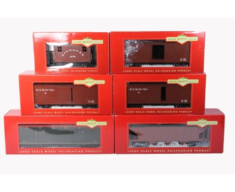 A collection of 6 Bachmann G-Scale 'Big Haulers' to include 3 'G' Box car (93320), 'L' Bobber &amp; Logging caboose (93120), 