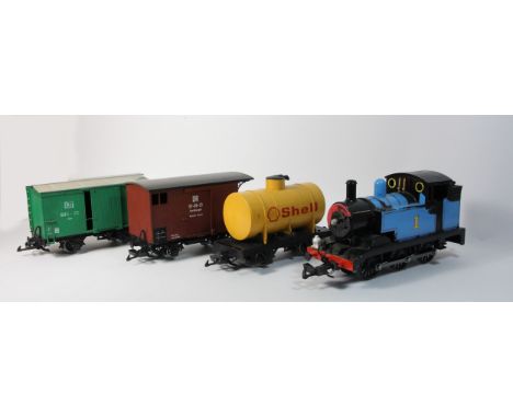 A Bachmann G-Scale 'Thomas' locomotive together with 3 Lehmann goods wagons to include Shell tanker 