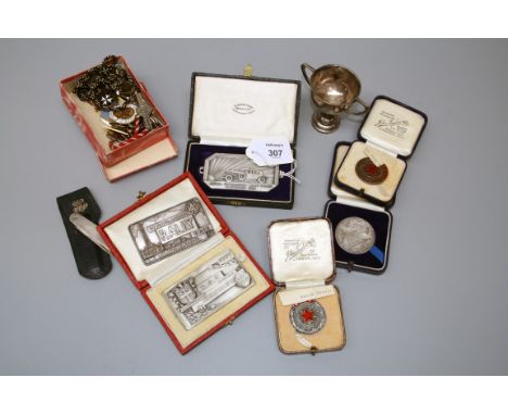 A cased Art Deco Royal Automobile Club Rally medal, Hastings 1933 together with a cased RAC Rally medal, Bournemouth 1934, an