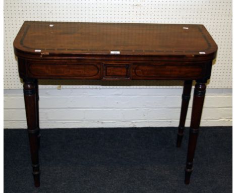 A George III card table, the D-shape coromandel strung foldover top with double gate support on ring turned tapering legs, 74