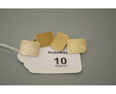 A pair of 18ct gold cufflinks of canted rectangular form with engine turned decoration, London 1936