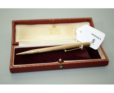 A 9ct gold propelling pencil with engine turned barrel, 12cm, 22gm