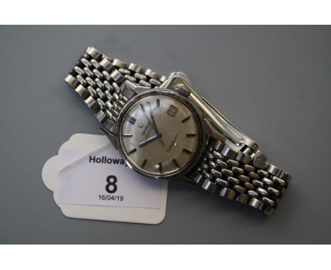 A gentlemans mid 20th century  stainless steel Omega Constellation wristwatch with champagne calendar dial, baton numerals an
