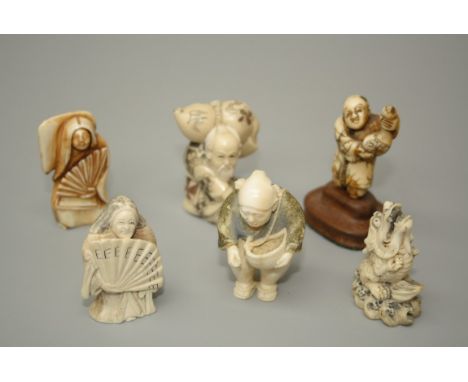 A group of six tagua and other netsuke, including a swivel faced man with fan, Kylin, man holding a gourd, etc