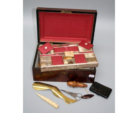 A late Victorian amboyna, mother of pearl inlaid needlework box, the tray fitted interior containing various sewing requisite