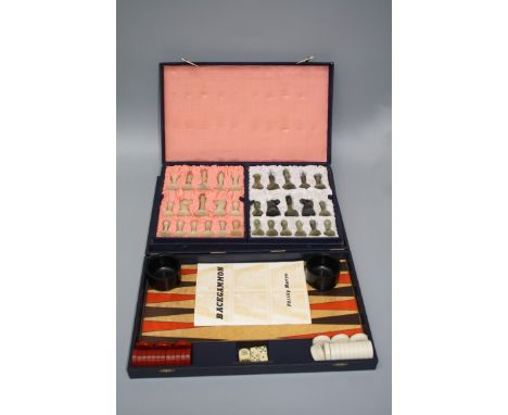 A 1970's Phillip Martyn backgammon set, together with a 20th century Chinese mutton fat and spinach jade set of chessmen in f