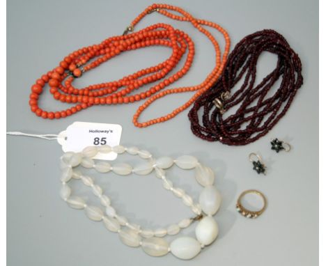 A graduated double row coral bead necklace together with another coral bead necklace, a sapphire and opal two row ring, a pai