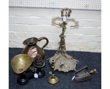 A Victorian copper one gallon copper harvest jug, a set of cast iron pan scales, a brass stick stand cast with hunting themes