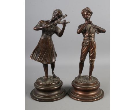 A pair of late 20th century bronze figures of a boy and a girl playing musical instruments, after Foneria Lancini. Height 26c