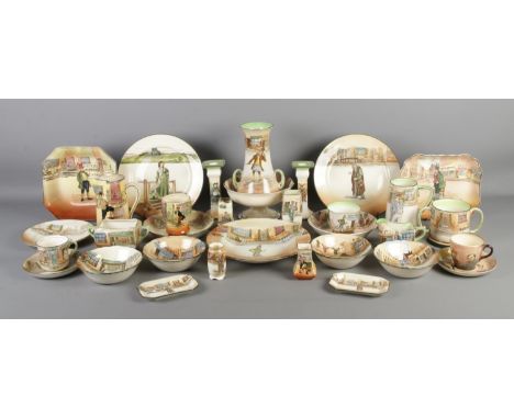 A very large collection of Royal Doulton Dickens Ware ceramics, including a pair of candlesticks (Fagin and Sairey Gamp), lov