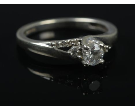 A 9ct white gold diamond ring. Approximately 0.4ct diamond. Size L 1/2. 2.5g.