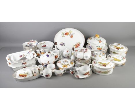 A large collection of Royal Worcester Evesham dinner wares to include lidded tureens, tea pot, gravy boat, cruet set, etc.