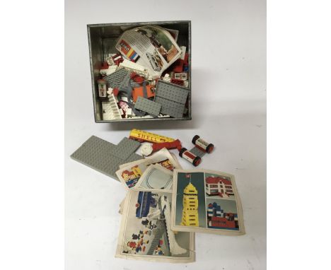 An tin of vintage Lego