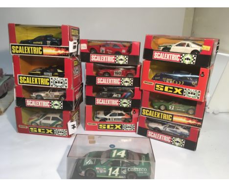 A selection of 12 Spanish scalextric cars and 1 NASCAR car. The 12 sc cars include a rare Ferrari gto with seven up advertise