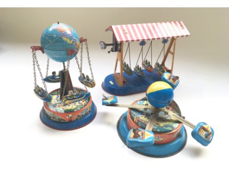 3 Tin Plate West German toys by J W Toys, consisting a Ferryboat, Carousel, and a Bumper Car Carousel.