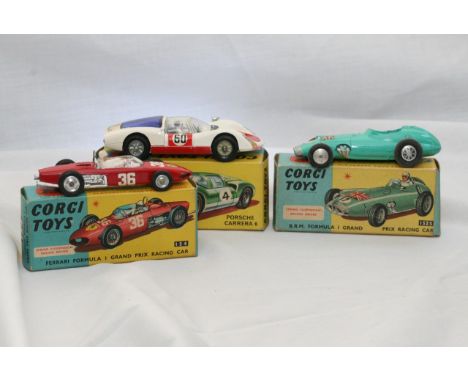 Three boxed Corgi racing cars including BRM no.152S (Missing driver), Ferrari no.154, and Porsche Carrera 6 No.330 (No.60 whi