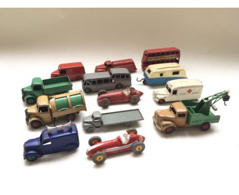 A collection of unboxed playworn Dinky Toys including Bedford tipper, dustcart, breakdown lorry, ambulance, 2 racing cars, lo